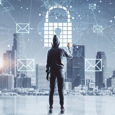 cyber criminal looking out over a city