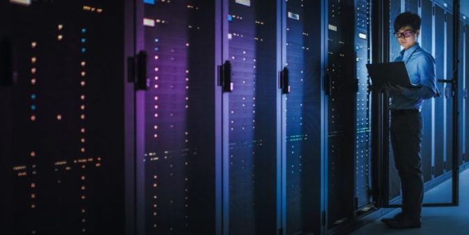 man standing in front of servers