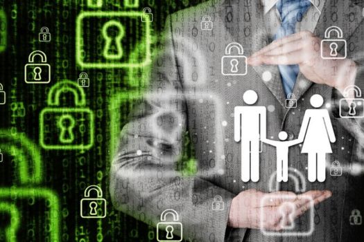a man holding image of a three person family with cyber padlocks