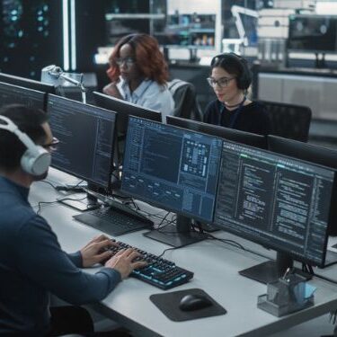 people working at a customer service call center