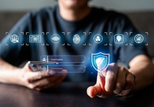 man sitting facing encrypted icons