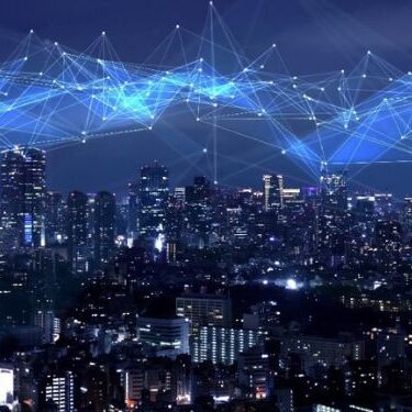 a city skyline with a digital protection grid over it