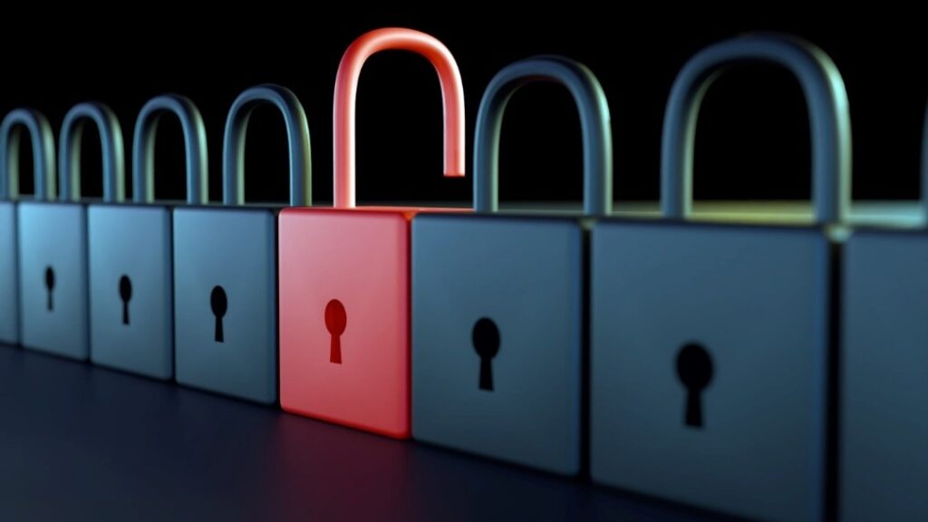 a few grey locked padlocks, one red one open