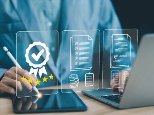 man checking off things on a tablet