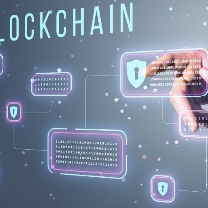 image showing "blockchain" written out with a hand pointing to a cybersecurity button