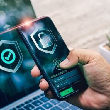 cell pohone being held with data encryption software on it