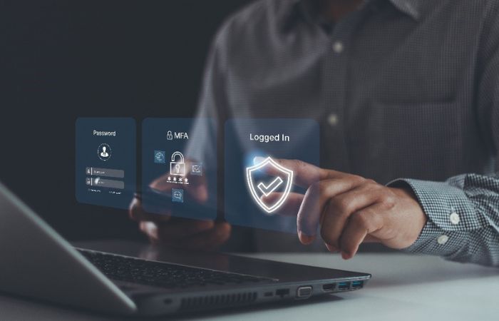 Image of a person touching a digital image of a login button