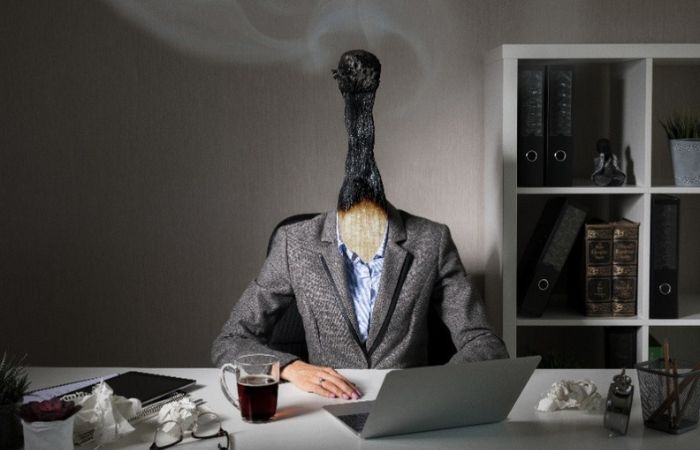 man torso with a burnt-out matchstick for a head