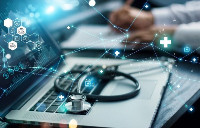 A stethoscope lying on a laptop