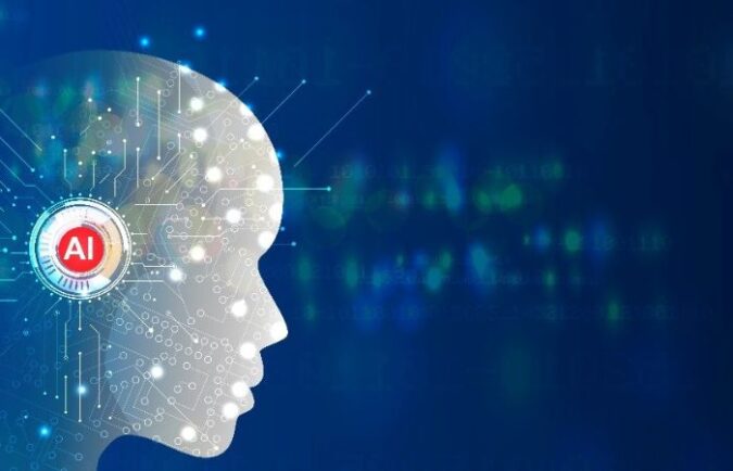 a digital silhouette of a human head with "AI" on the side of it looking to the right