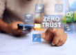 image of a man sitting with zero trust written across the screen