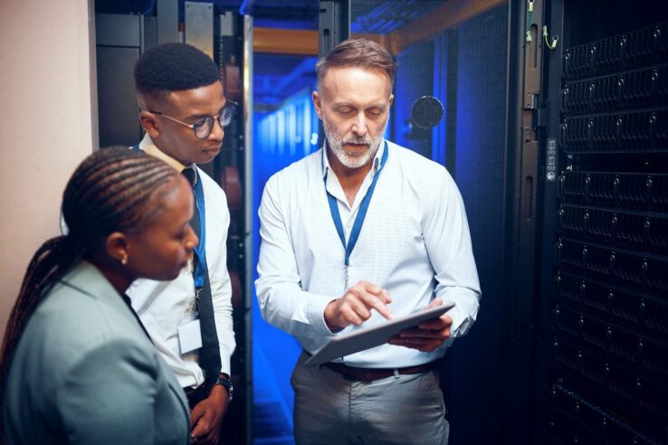 Image of an on site IT employee at a location showing the customer whats wrong