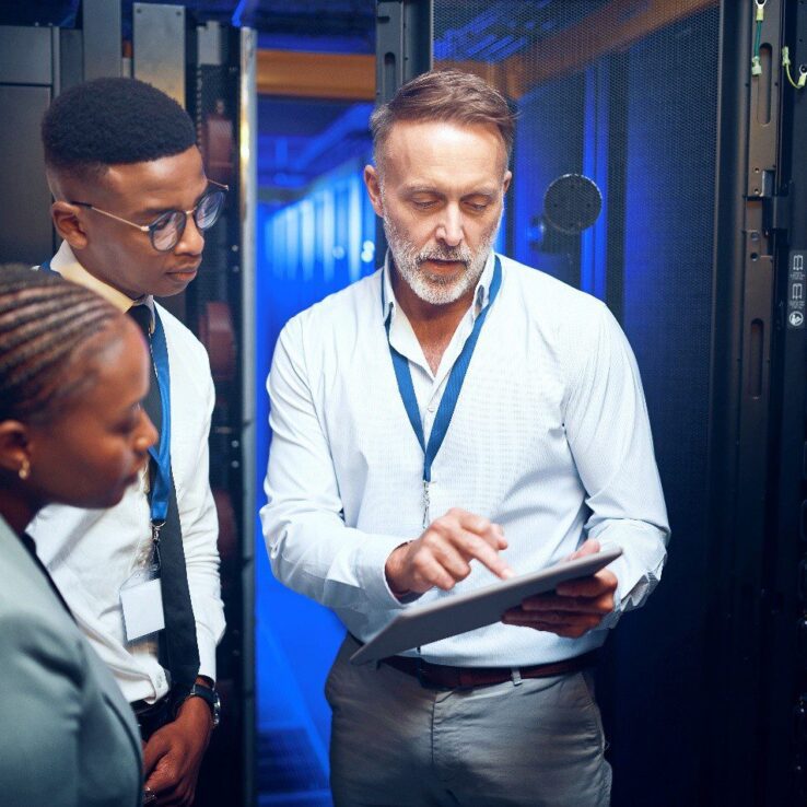 Image of an on site IT employee at a location showing the customer whats wrong